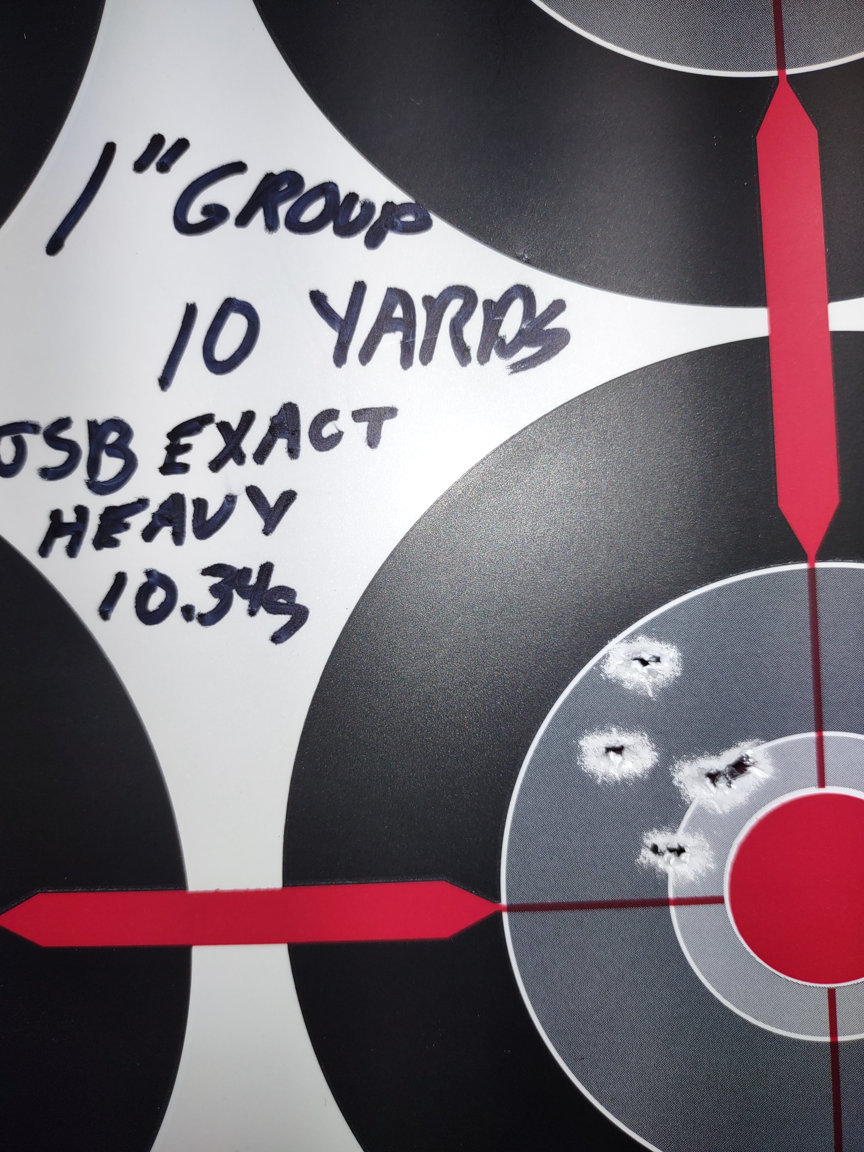 5 shot group at 10  yds, 1 inch size, 5 inches low using JSB Exact 10.34 gr pellets..jpg