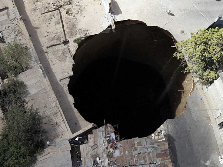 FUN. The Airgun Hole -- So Deep, So Wide. 01Ab. Guatemala City Sinkhole, Guatemala, 2010, 100f...jpg